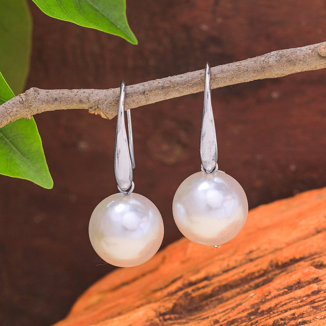 Minimalist Silver Earrings Featuring A Striking, Large Pearl.