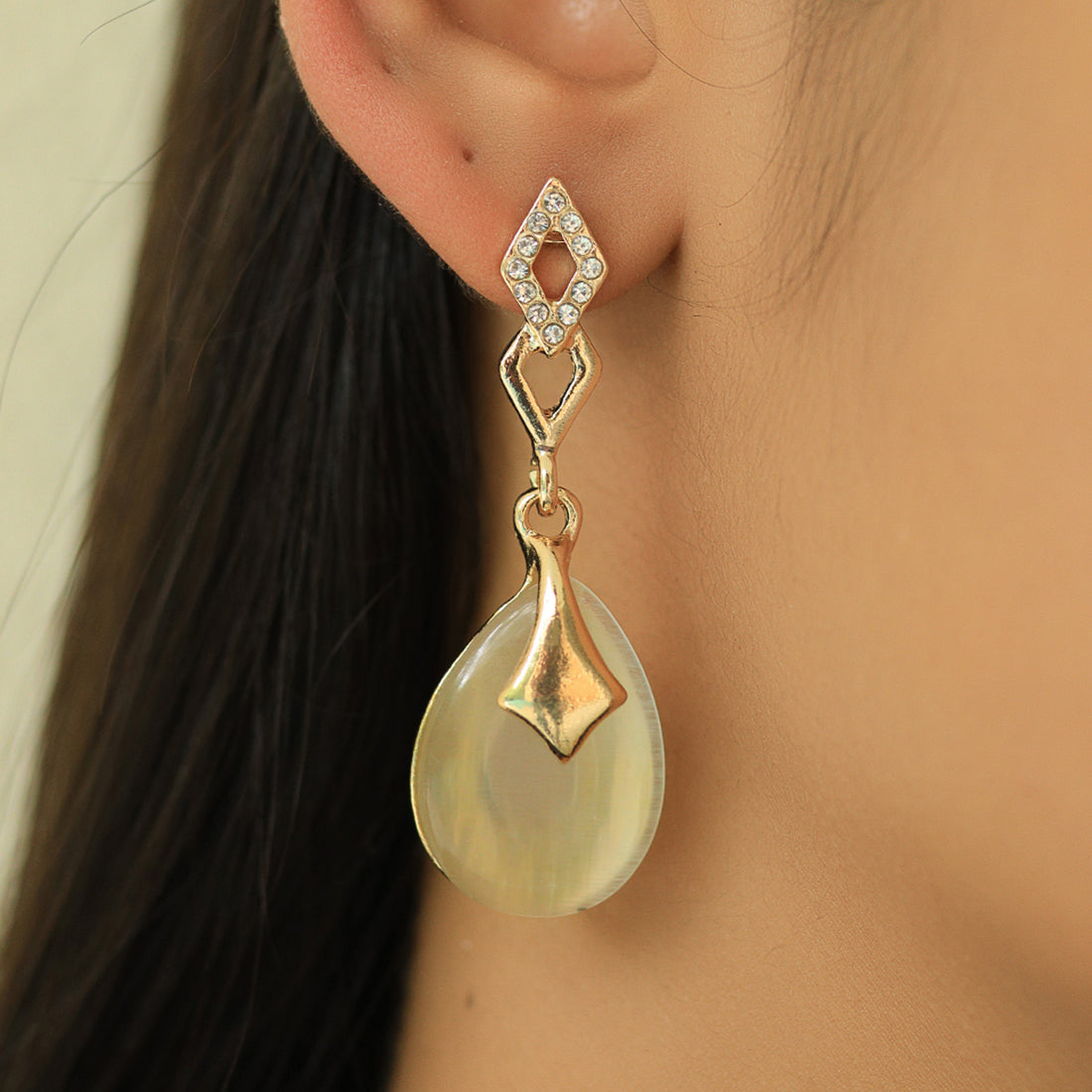 Elegant Gold-Toned Oval Shape Diamonti Stud Earrings With Moonstone Drops
