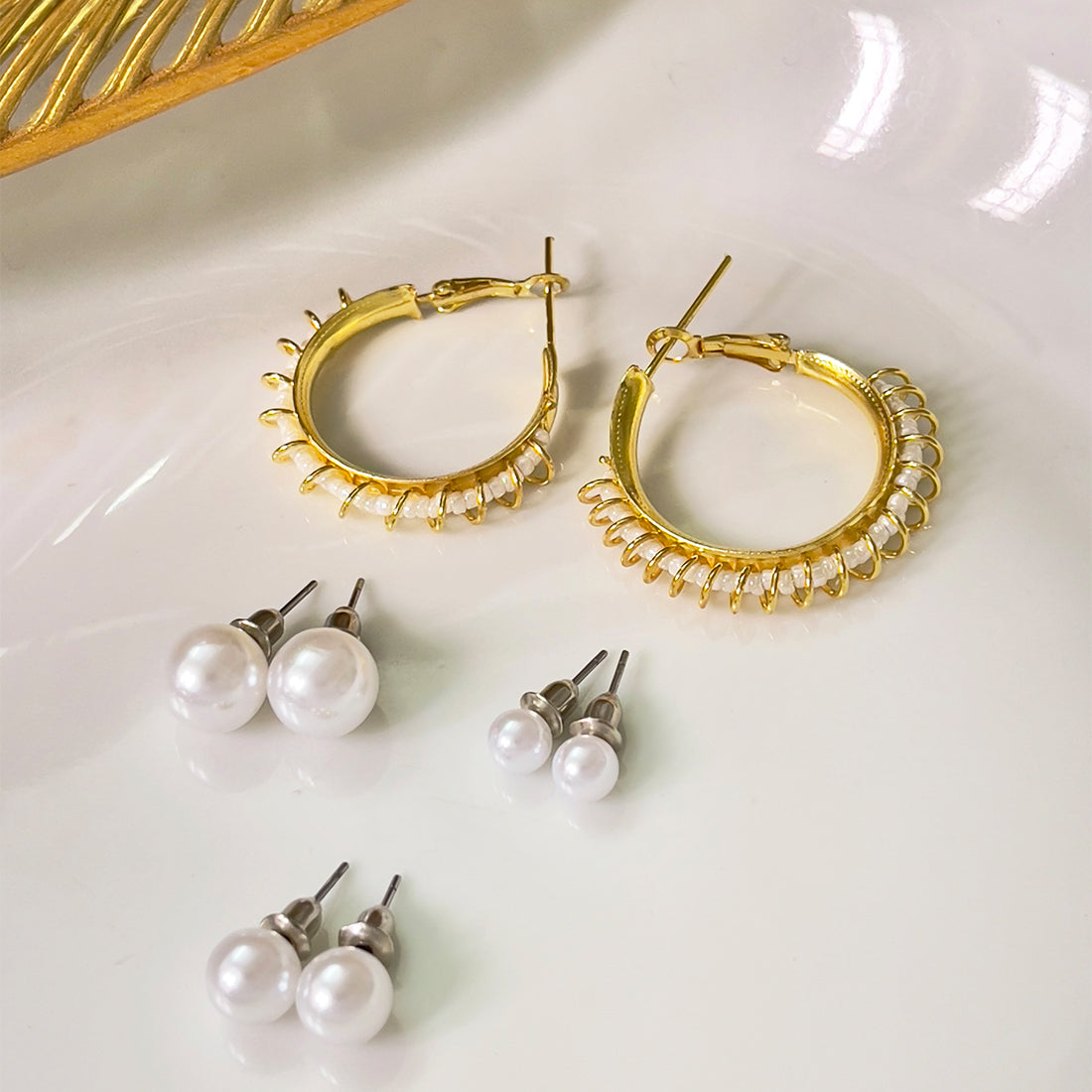 Set Of 4 White Pearl Studs In Different Sizes & Gold-Toned Wire Wrapped Hoop Earrings
