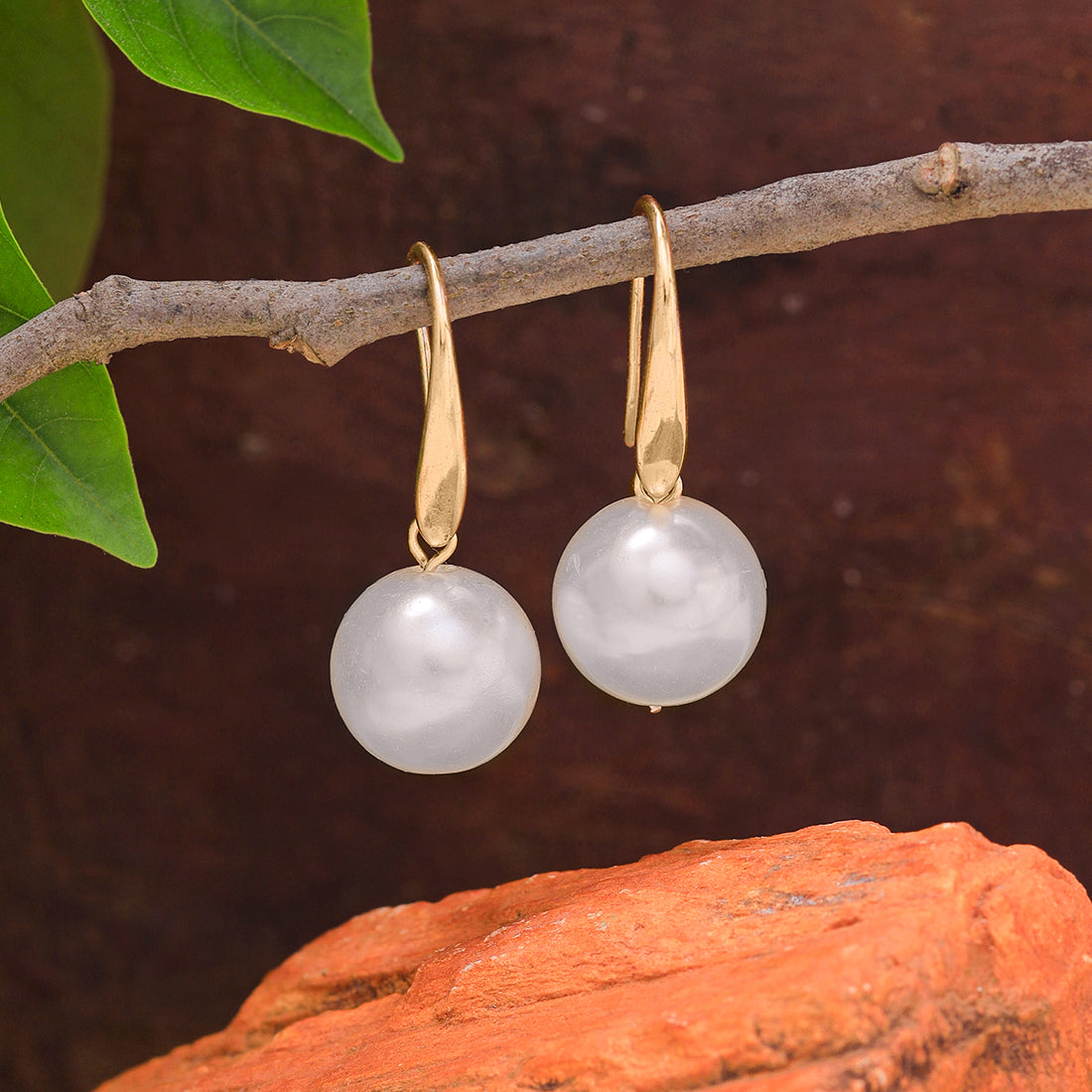 Minimalist Gold Earrings With A Prominent, Single Big Pearl.