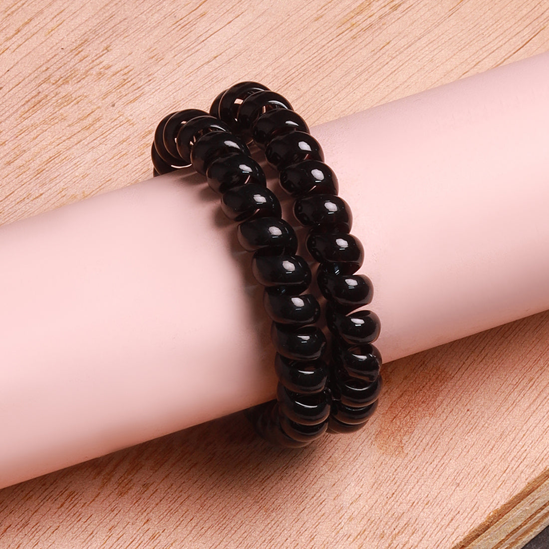 Ayesha Durable set of two black rubber bands with a unique telephone wire design.