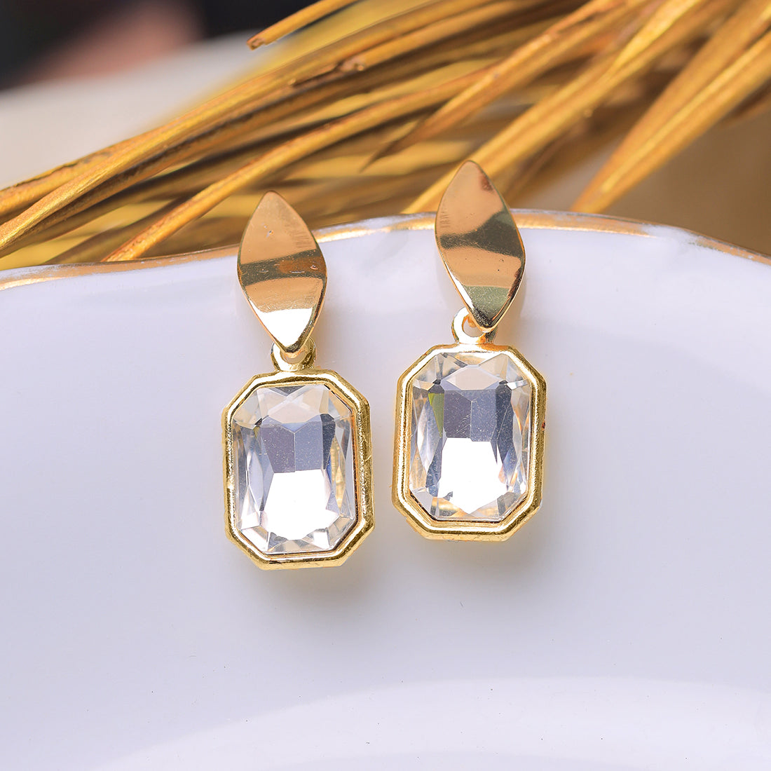 Elegant Gold-Toned Stud Earrings Featuring A Dazzling Square Rhinestone Drop.