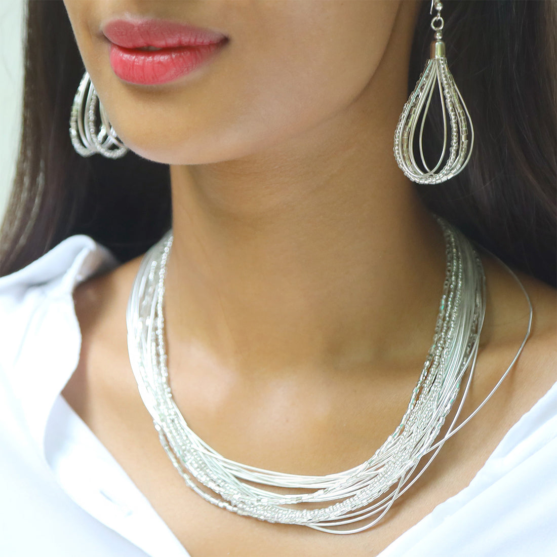 SET OF TWO SILVER-TONED BEADED MULTILAYERED NECKLACE & EARRINGS